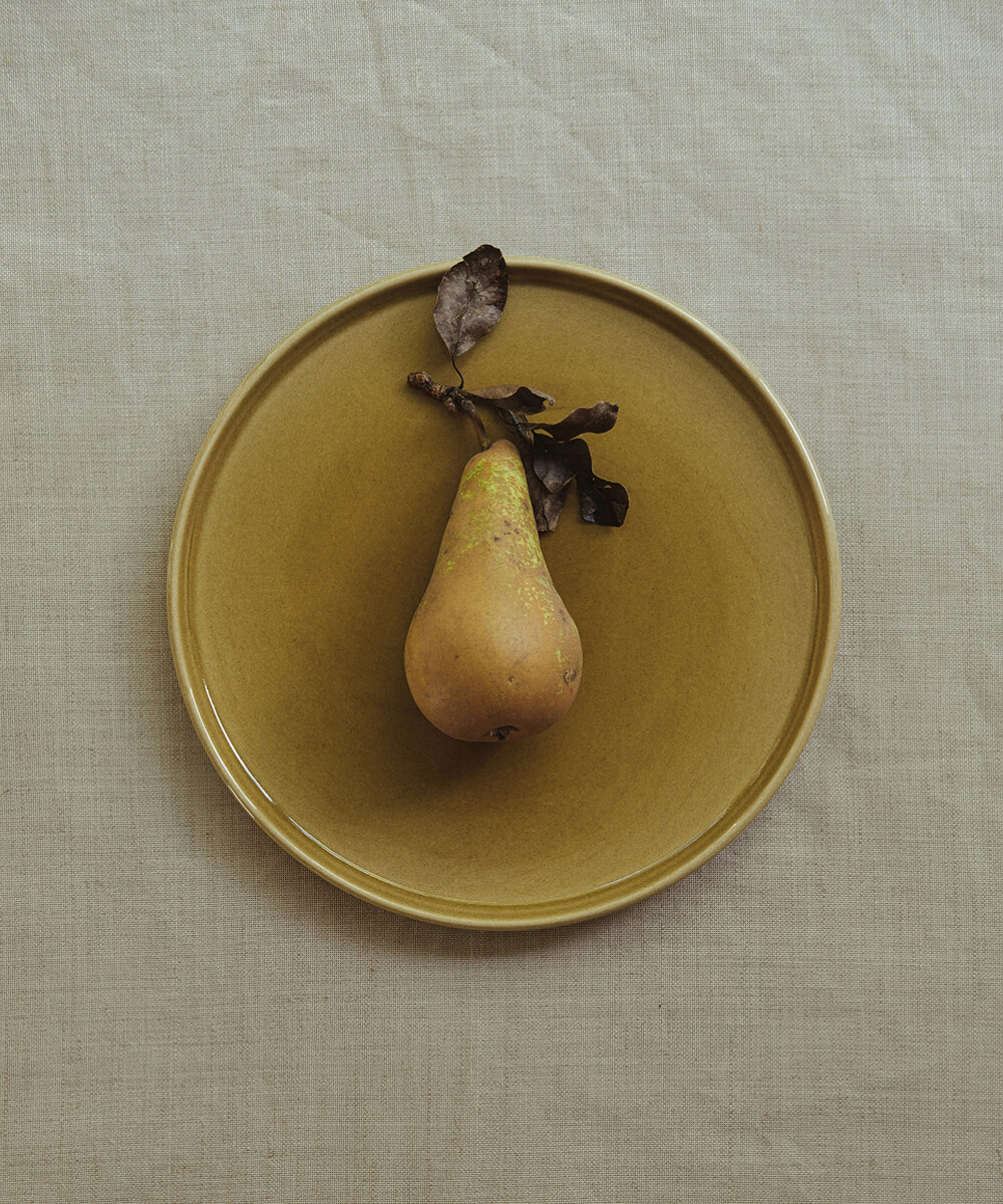 Picture with a pear on a plate